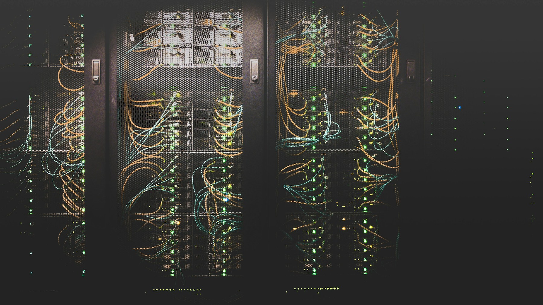 Server racks and connected cabling inside a data center